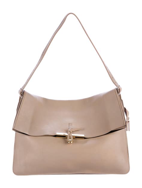 celine clasp leather handbag|More.